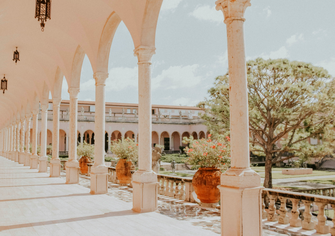 Looking out to the courtyard from the column-filled terrace at Ringling Museum in Sarasota, Florida.
