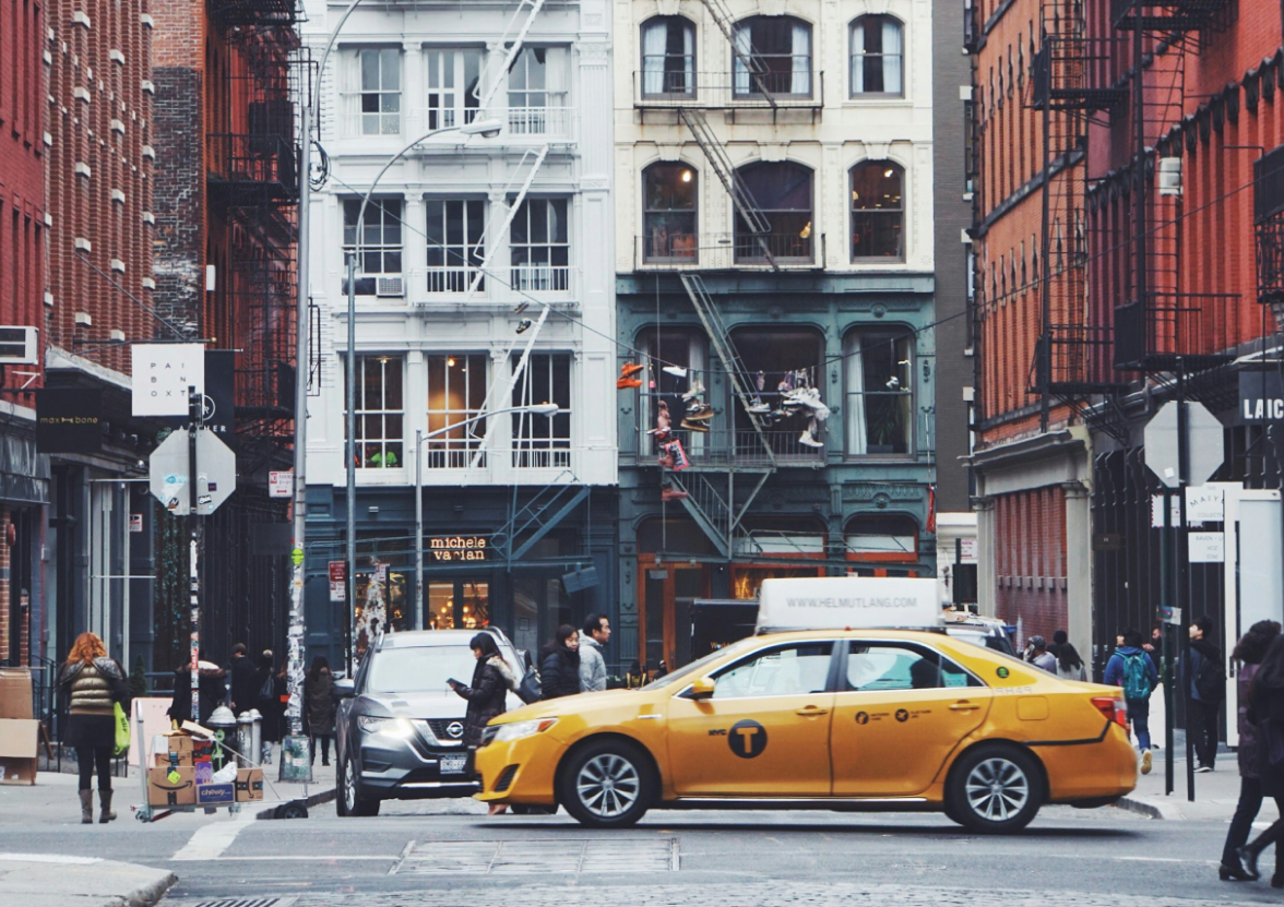 A yellow cab among a city of bricks in New York City, New York.