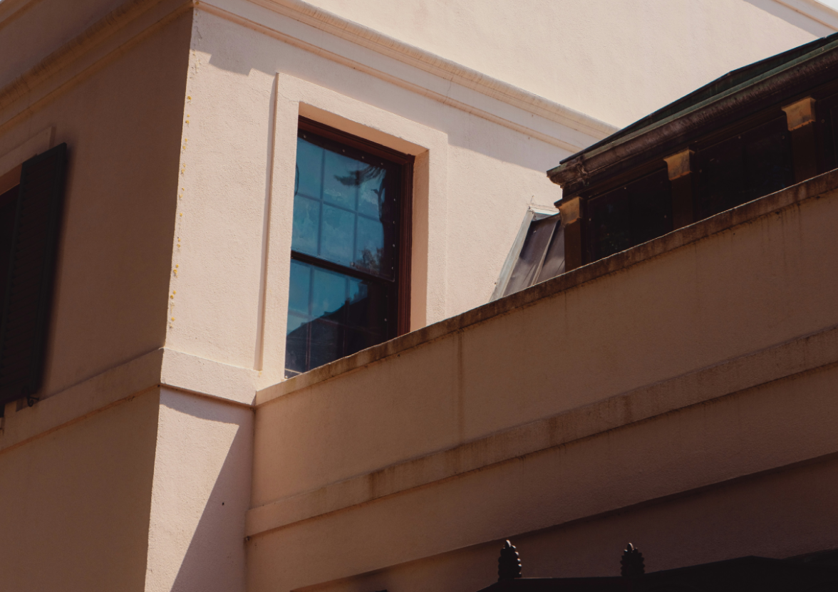 Shadows on a building nested in the Bayou Ben Collection and Gardens, a facility of the Museum of Fine Arts.